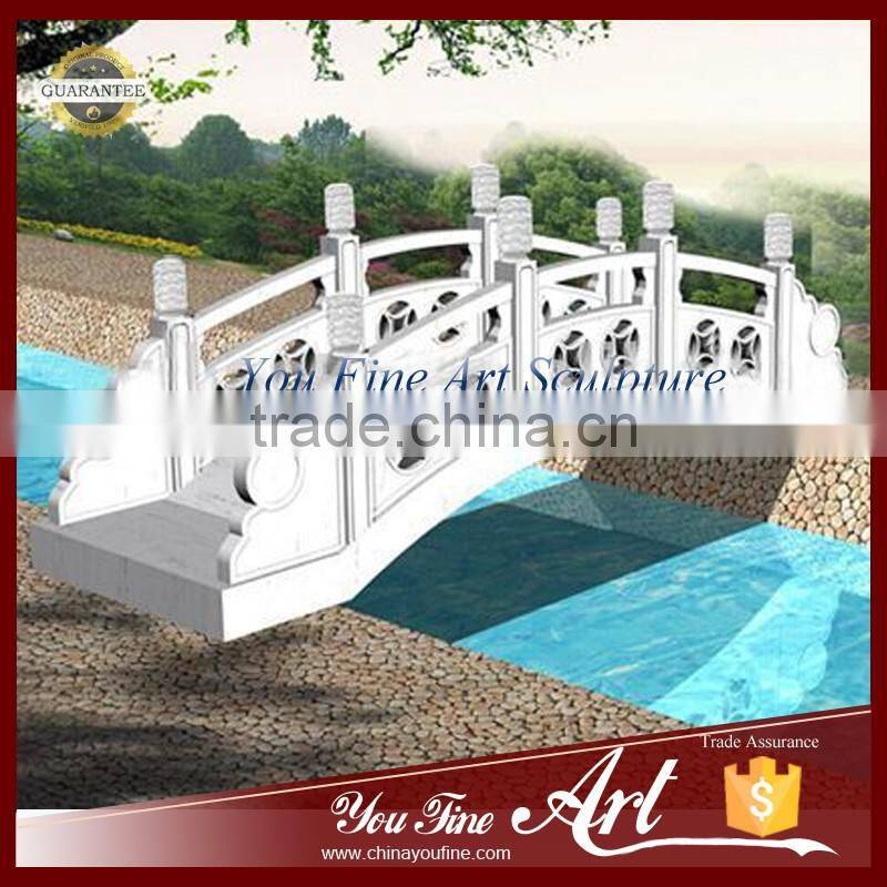 decorative garden bridge in stone