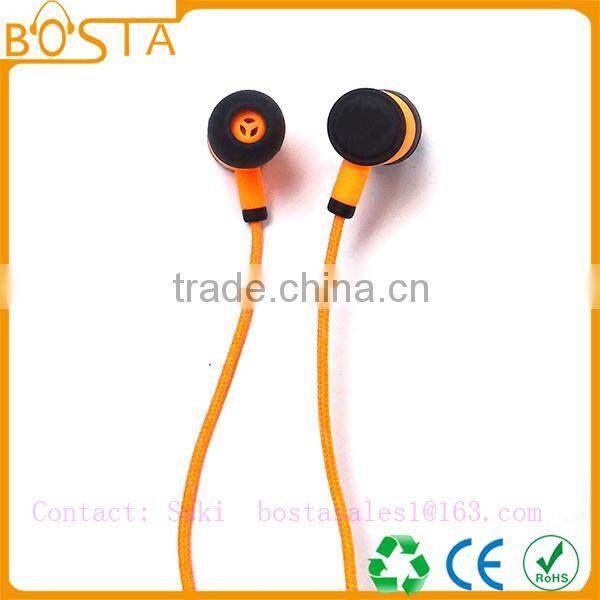 Sports sweat-proof wholesale shiny orange soft ruberized string bluetooth earphones