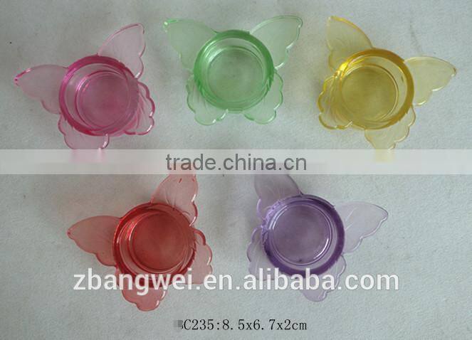 butterfly-shaped glass candle holder