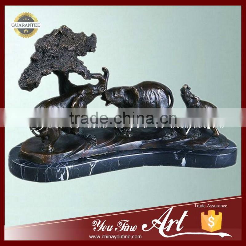outdoor bronze elephants playing sculpture