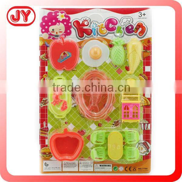 Children playing plastic toy vegetables with EN71