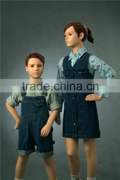 Christmas window display dress up realistic children mannequins