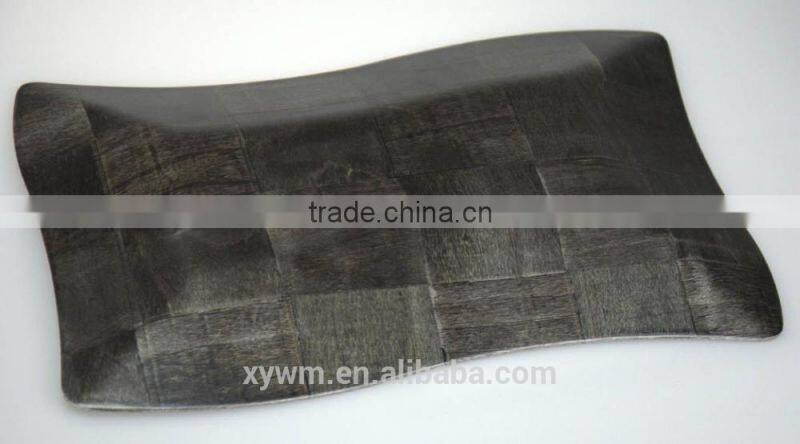 Black woven wooden serving tray and plate