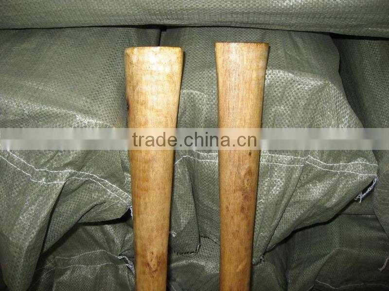 Garden used steel pickaxe with wooden handle