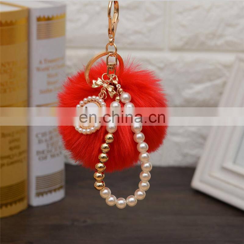 2021 Wholesale custom luxury fur ball key holder Pearl keychains pom pom bow keychain for women bag good quality