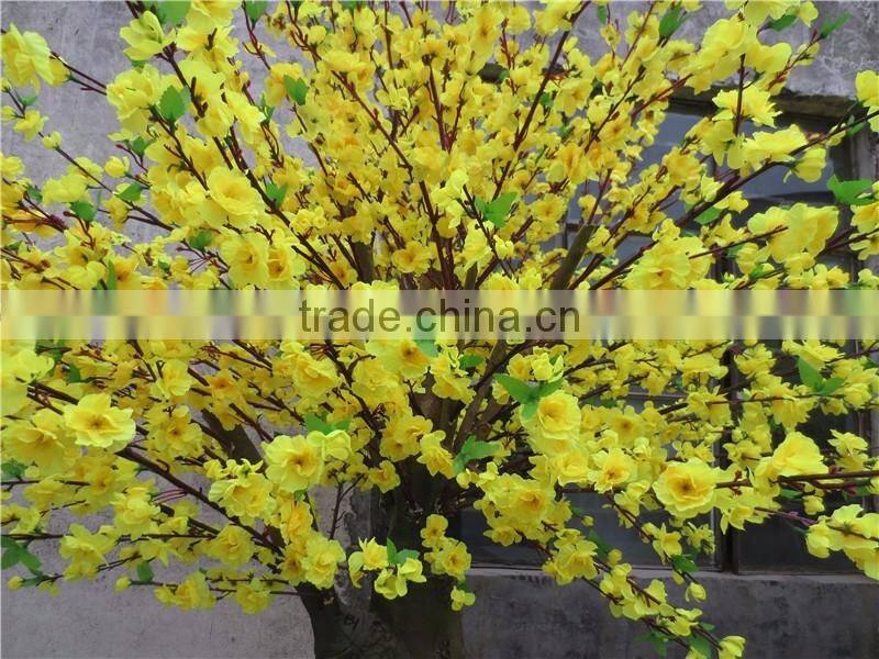 Yellow silk cherry blossom tree with artificial flower