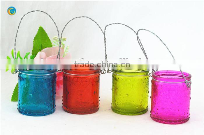 decorative wall hanging jar candle holder with black metal wiring cross pattern