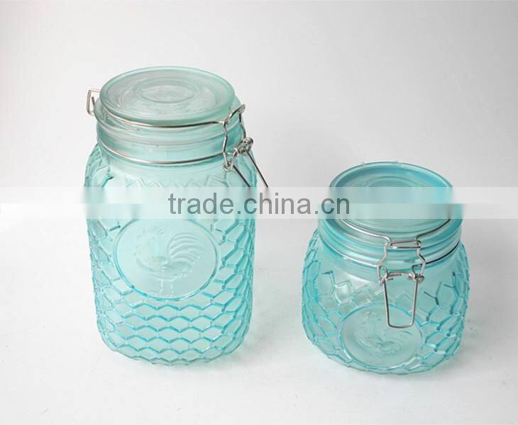 turquoise rooster embossed glass jar with metal clip fastening