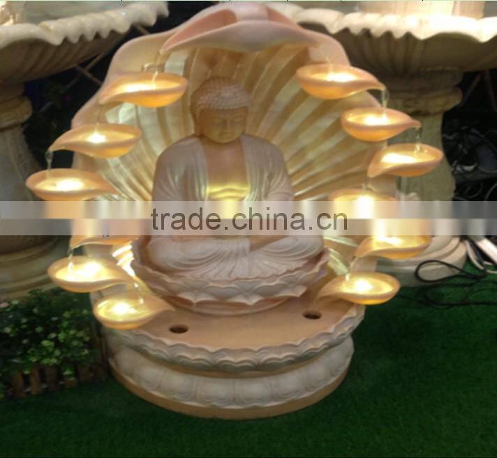 buddha sandstone fountain around flowing water