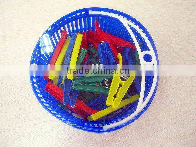 New foldable plastic basket with colorful clothes pegs