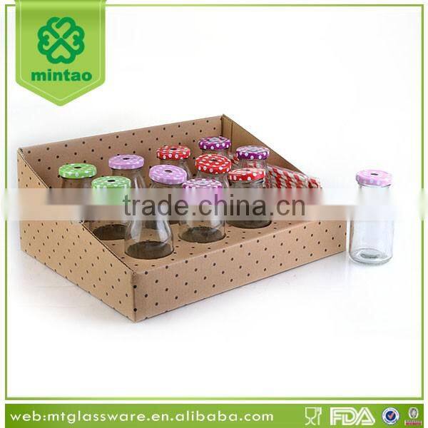 display box packing small glass bottles with lids and paper straw