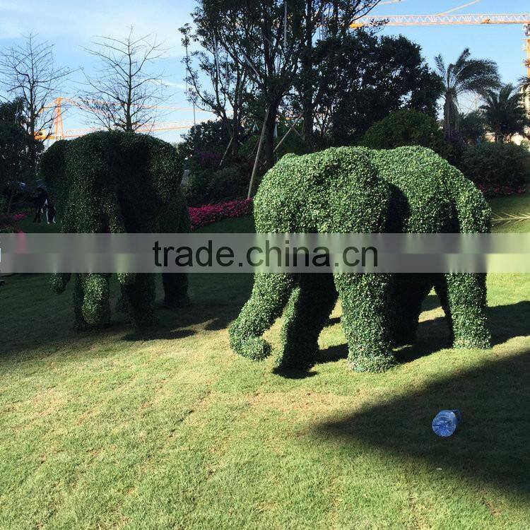 Fiberglass elephant sculpture with artificial grass