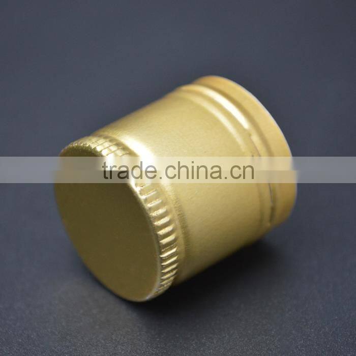 Golden aluminium caps for wine glass bottles