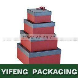 white nested cardboard boxes with ribbon design