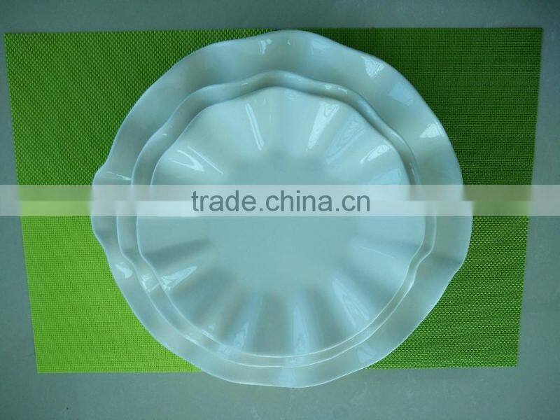 small white porcelain plates with cut edge shape