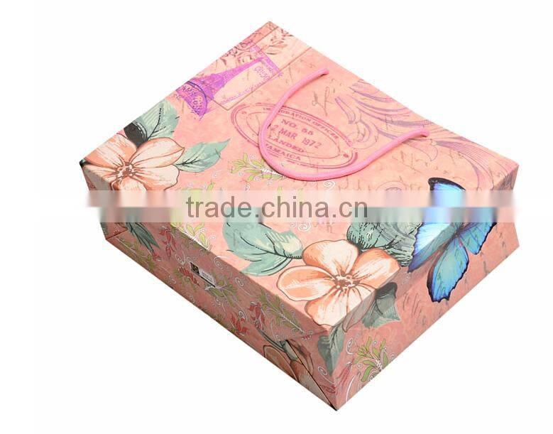China brighten glossy limination paper bags for shopping with nylon handle