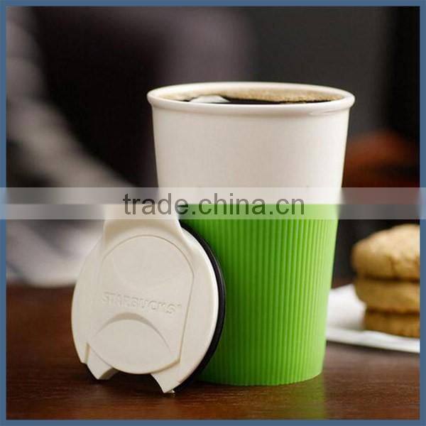 Modern simple ceramic travel coffee mug with silicone sleeve and lid