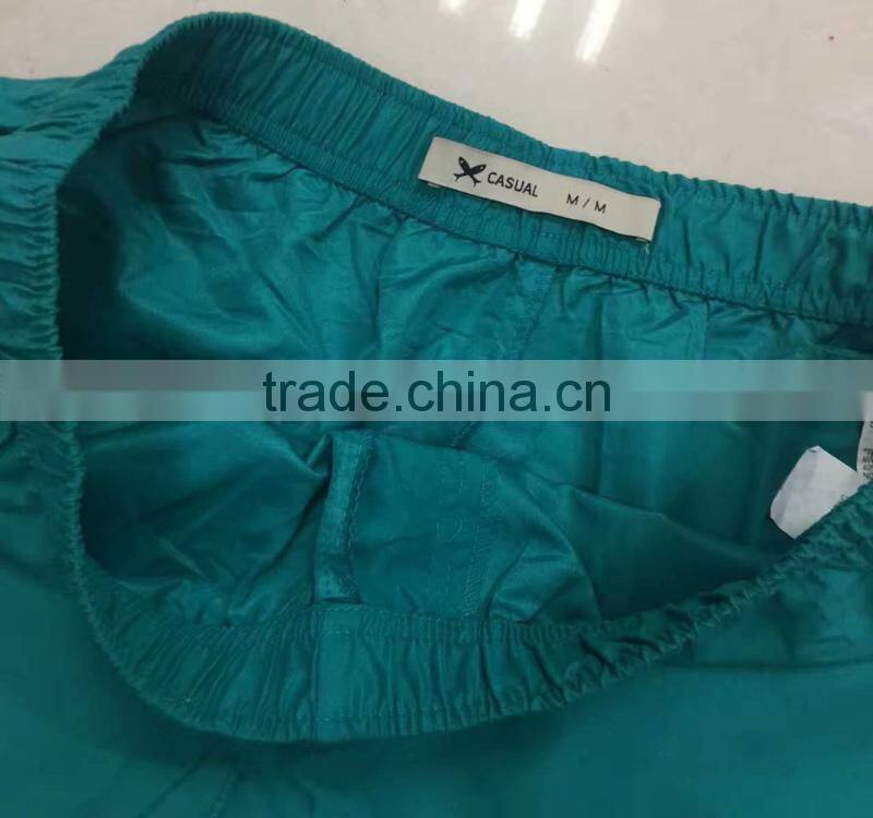 China stocklots men 100%polyester pure color bermuda shorts