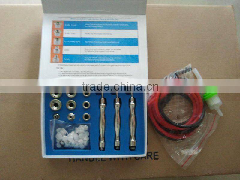 Portable diamond tip microdermabrasion machine