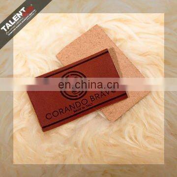 high quality customized private brand name logo jeans genuine leather patch in garment