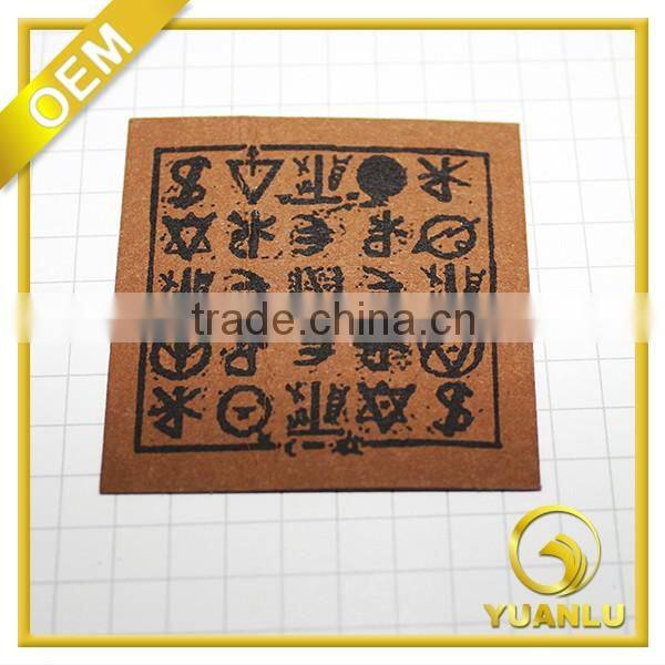 Embossed leather label essential jeans label