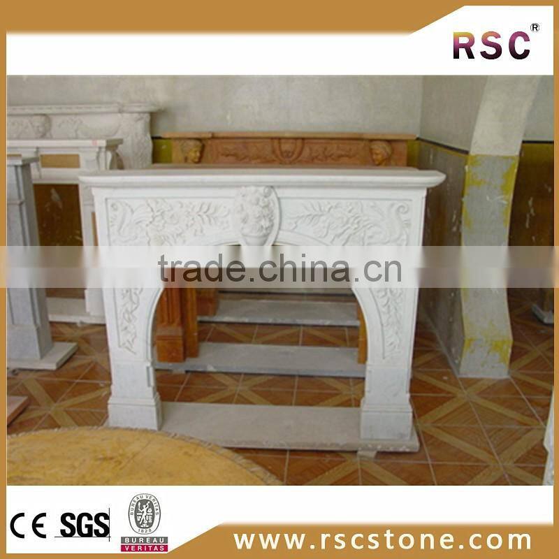 Stone fireplace mantel with lamp carving