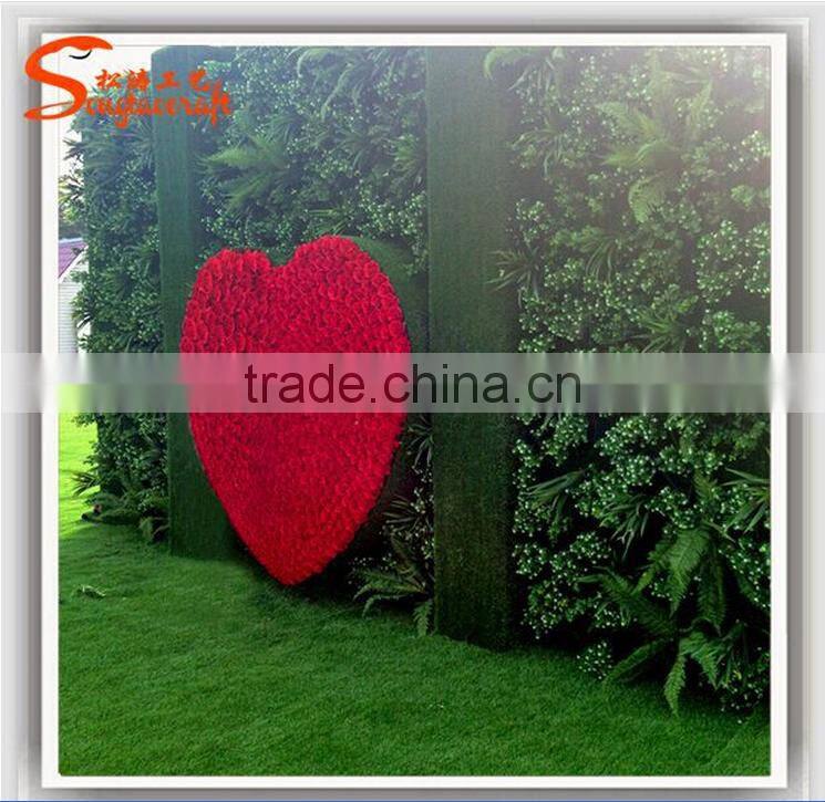 Green artificial garden plant wall