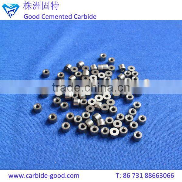 Discharge valve seat made from tungsten carbide