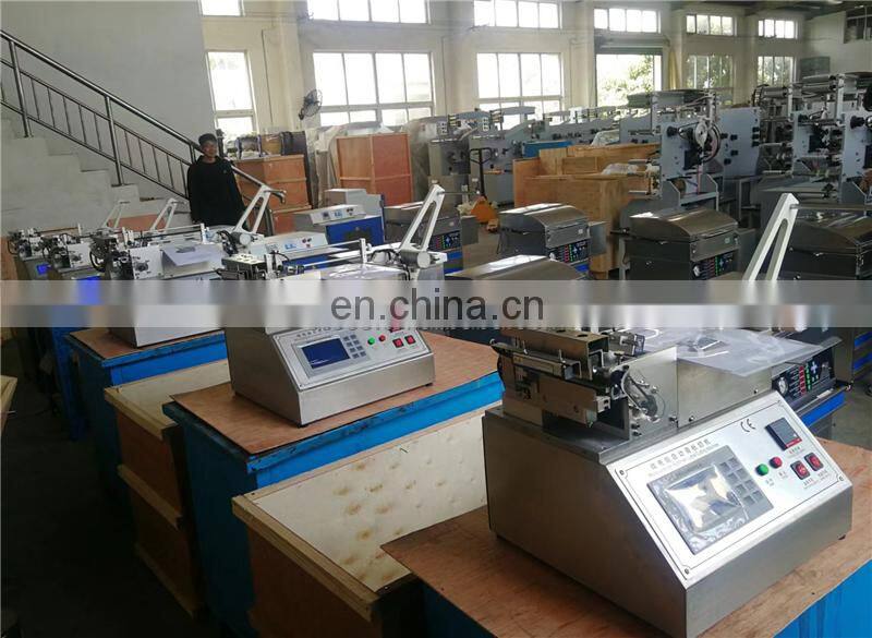 UGS2050 hot cold mini table top automatic fabric woven label cutting machine, small garment wash care ribbon cutter