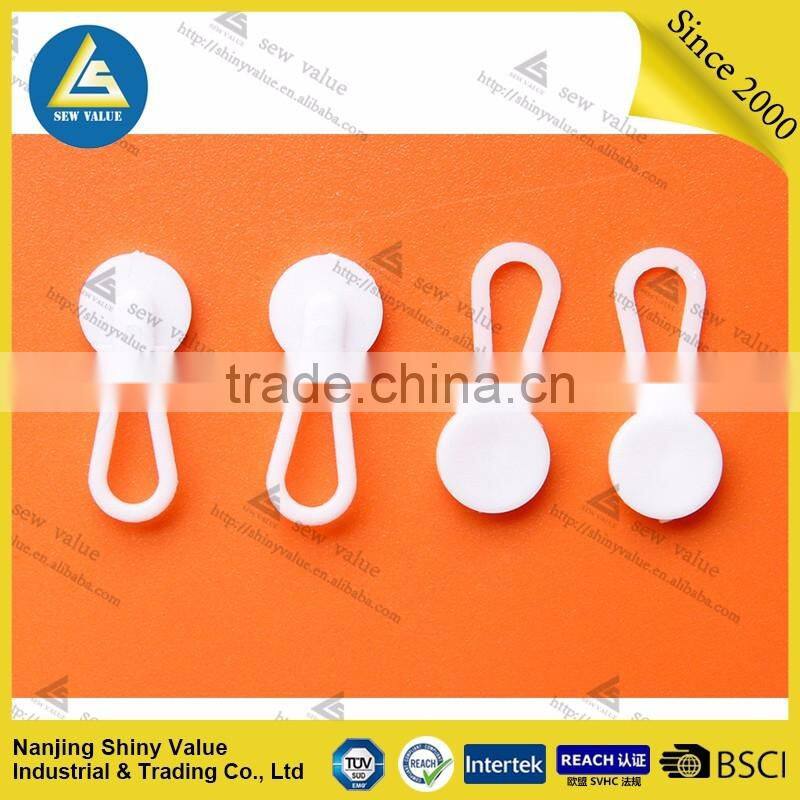 Plastic material shirt button extenders for easy fitting of your dress
