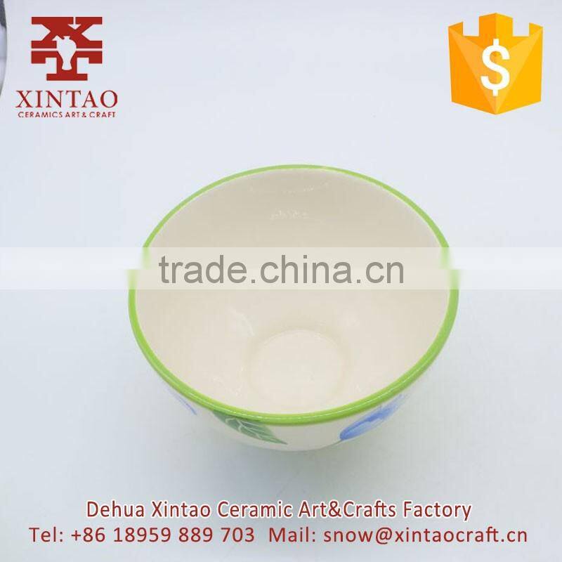 Small white ceramic soup bowl with green rim for hotel use