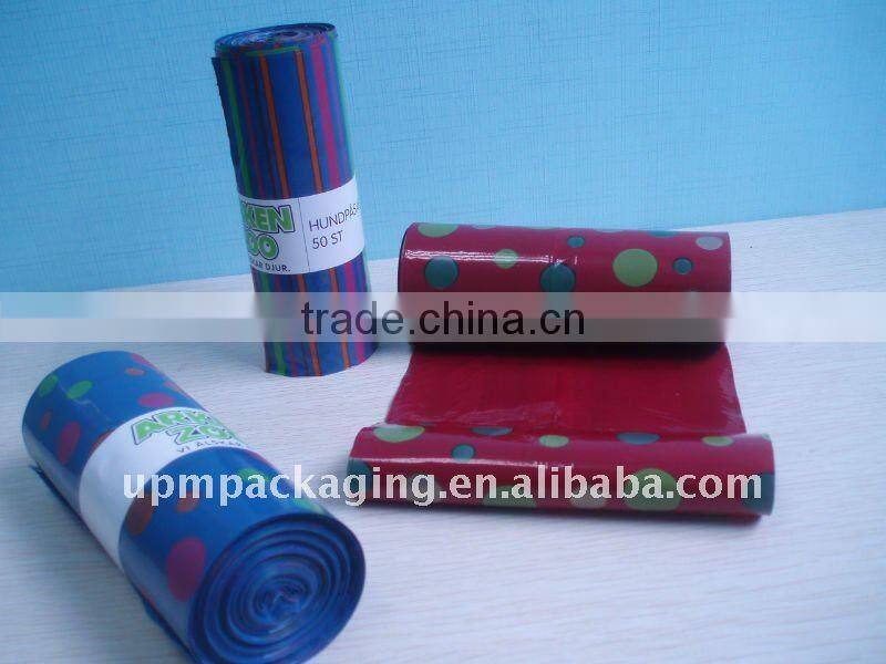 Colored plastic sack bag on roll for carry