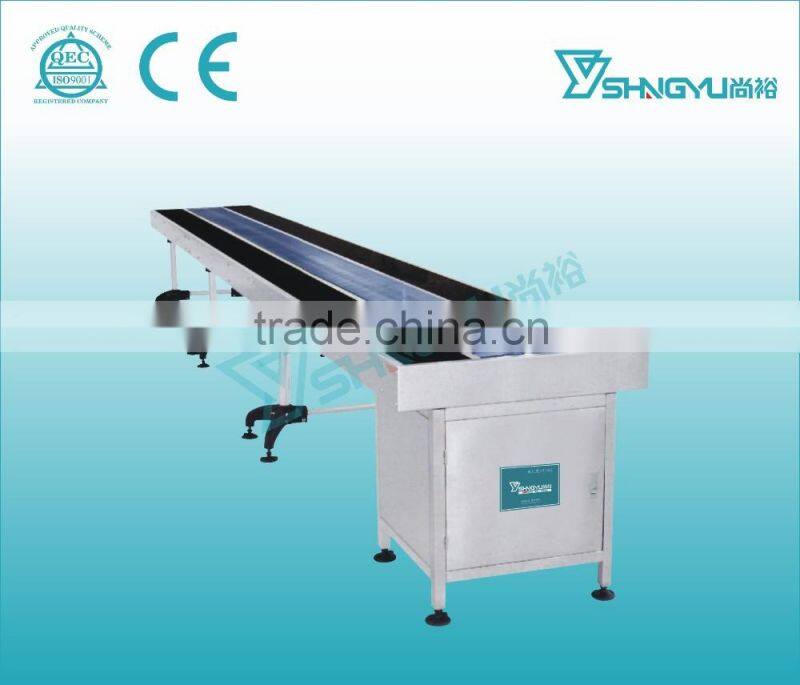 Guangzhou tempered glass chain belt conveyor table for heavy product