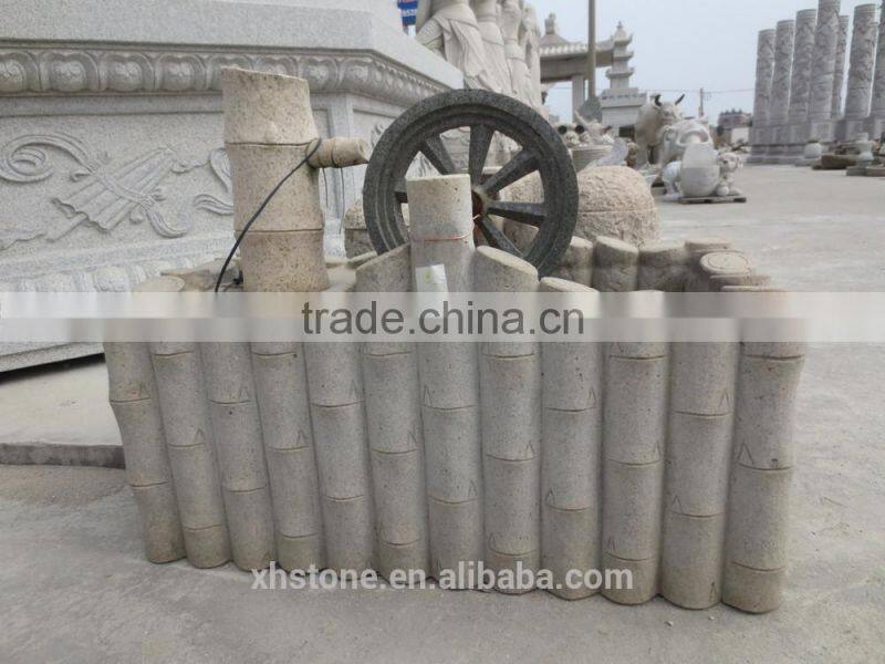 Hand carved garden stone water fountain in Chinese well style .