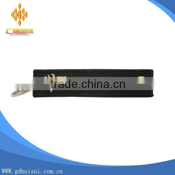 Popular design cheap customized elliptical shape embroidery personalized logo key chain