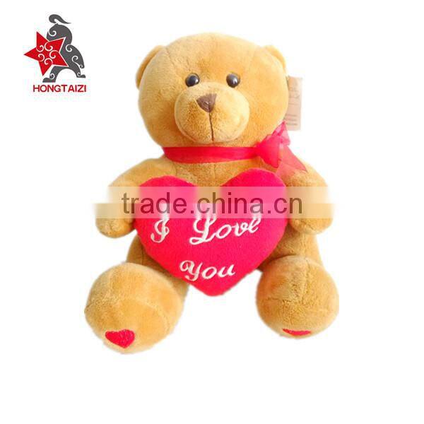 Stuffed soft plush bear with love heart