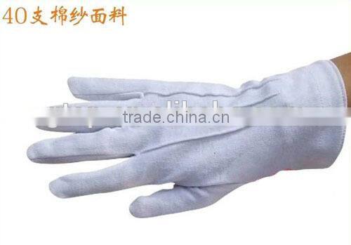 white cotton hand gloves