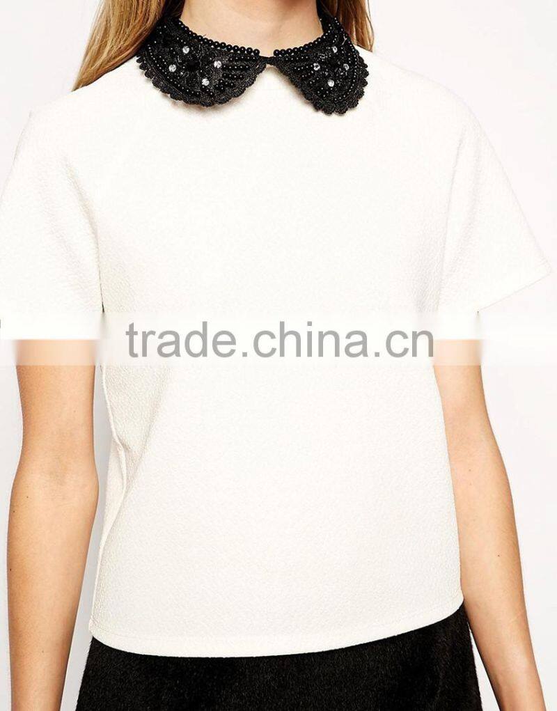 White short sleeve beaded ruffled beaded neckline top
