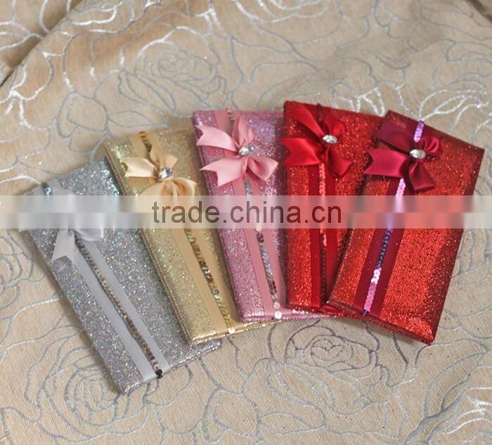 Hot sale attractive golden hardcover folded wedding invitations with paillette ribbons bowkont & crystal decoration