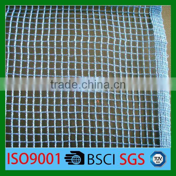 Building Covered With Construction Debris Netting for Protection