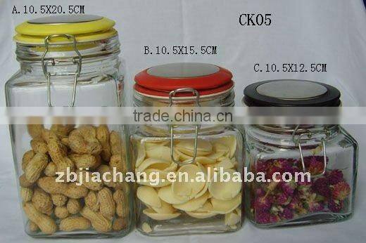 Square glass jar used for storage jam with clamp