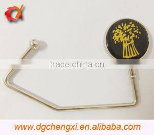 China hot sale round shape bag hanger with CX logo and metal hook