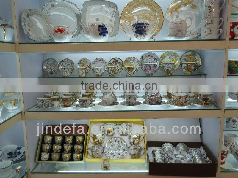 plated porcelain tea cup and saucer