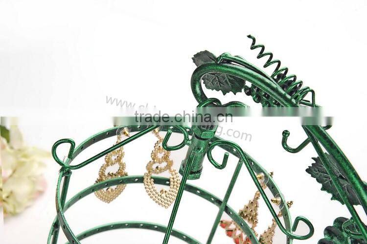 Metal display stand for jewelry with a birdcage for earrings