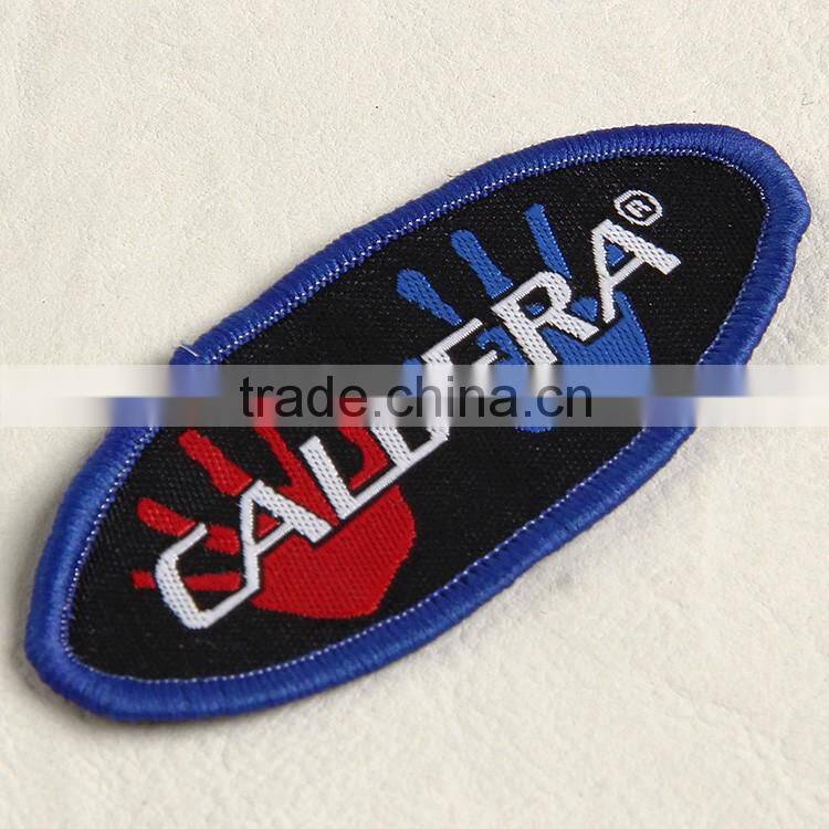 Customize elliptical shaped woven tag with binding for boy's brocade sweater