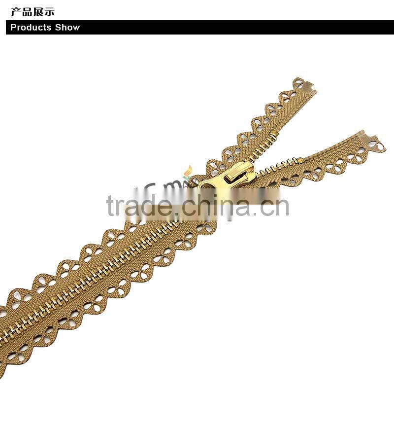 One close Euro style shiny gold metal zip for bag
