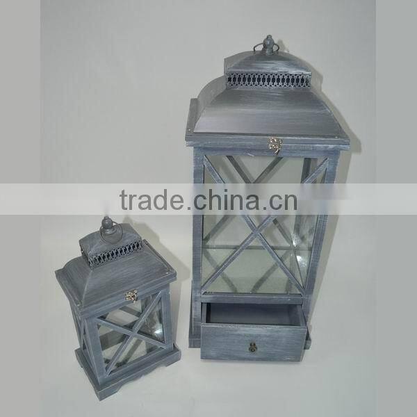 Brown wooden candle lantern with drawers