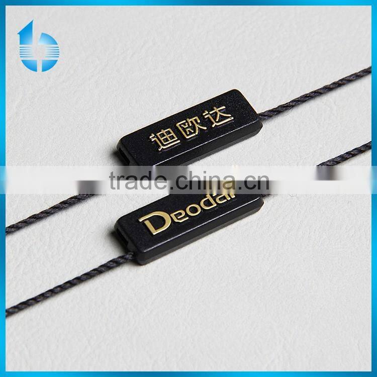 Single insertion plastic seal tag for garments hang tag lock