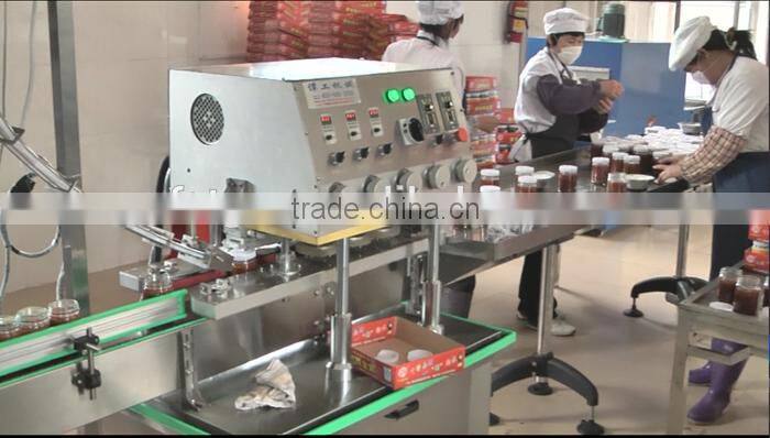 food sauce in jar bottle filler and capper