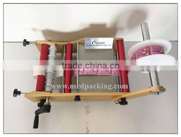 Hand Labelling Machine Pet Bottle Labeling Machine Round Jar or Cylinder Labeling